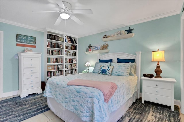 bedroom featuring dark tile patterned flooring, ceiling fan, and crown molding