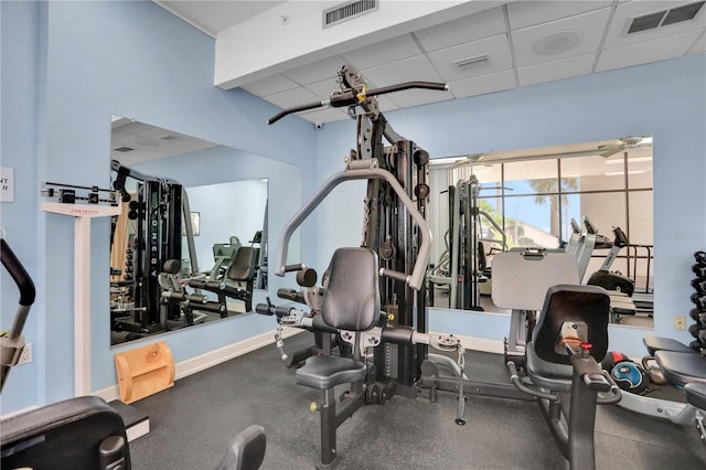 workout area with a paneled ceiling