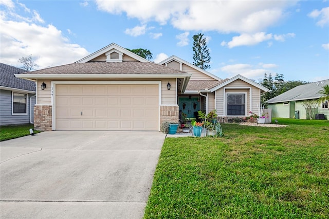 view of front of home with a garage and a front lawn