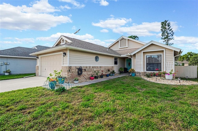 view of front of house featuring a garage and a front lawn