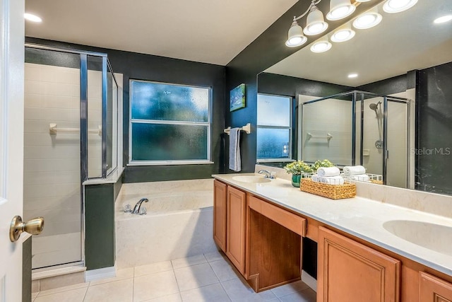 bathroom with tile patterned flooring, vanity, and plus walk in shower