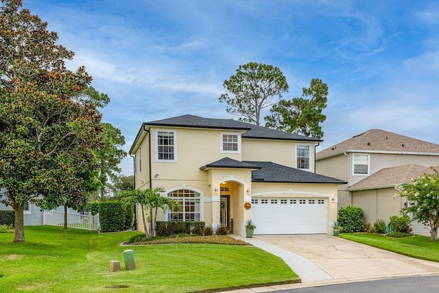 view of front of home with a garage and a front lawn