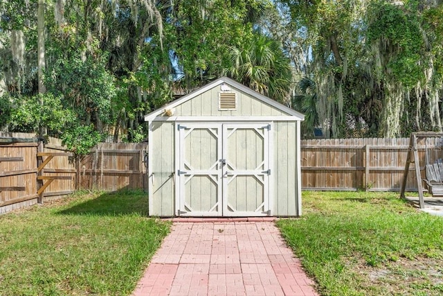 view of outbuilding with a yard