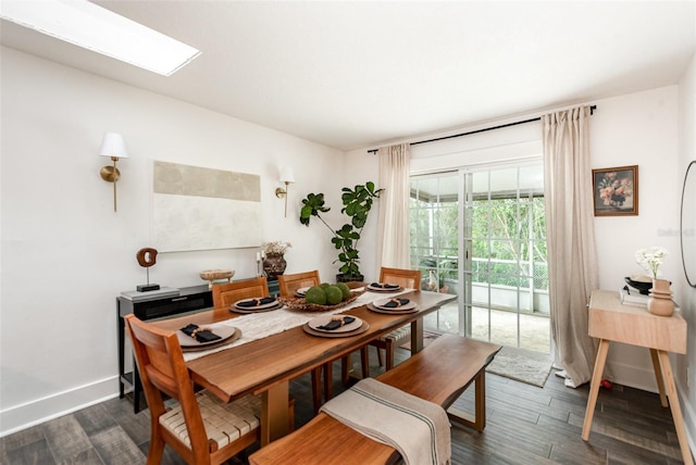 dining room with dark hardwood / wood-style flooring