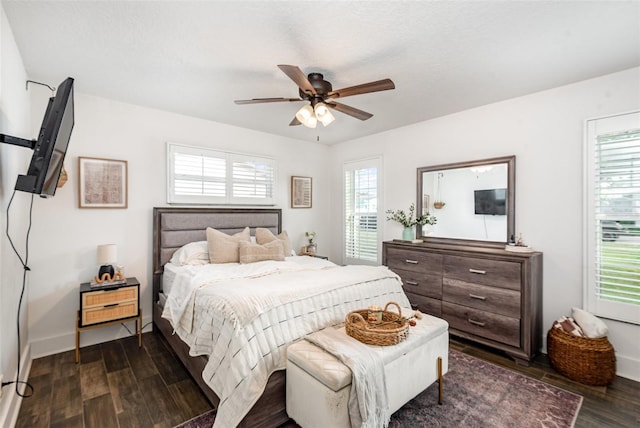 bedroom with ceiling fan and dark wood-type flooring