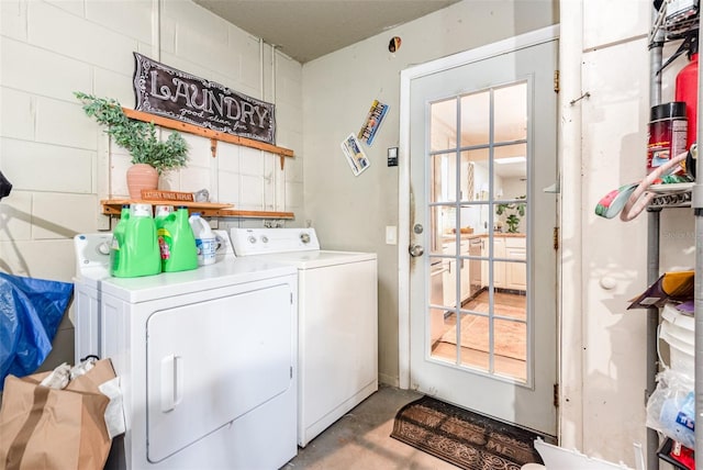 laundry room with separate washer and dryer