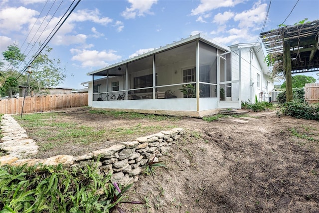 rear view of house featuring cooling unit