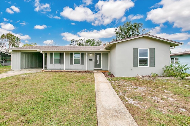 ranch-style house featuring a front lawn and a carport