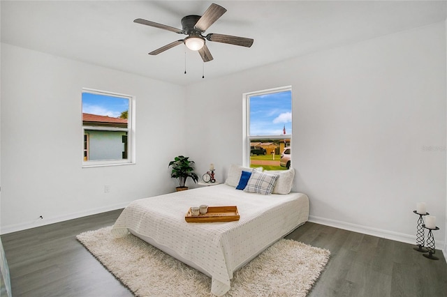 bedroom featuring ceiling fan and dark hardwood / wood-style floors