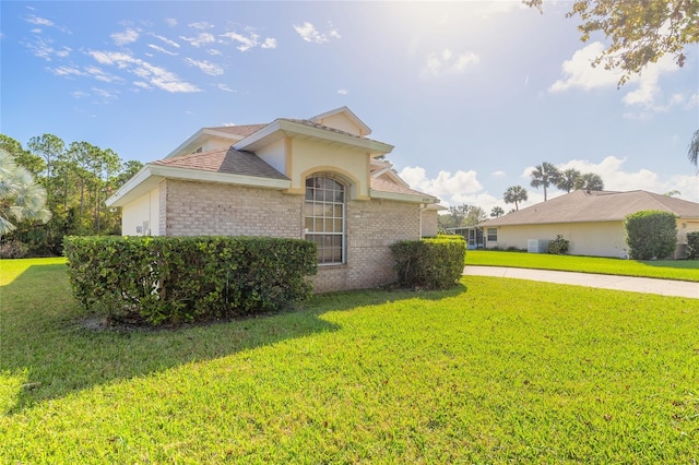 view of property exterior with a yard