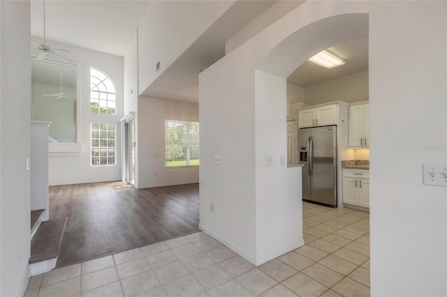 interior space with ceiling fan and light wood-type flooring