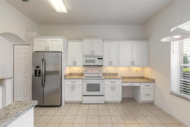 kitchen featuring white cabinets, light tile patterned floors, white appliances, and light stone countertops