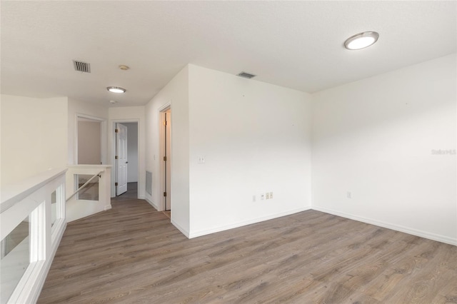 spare room featuring hardwood / wood-style floors