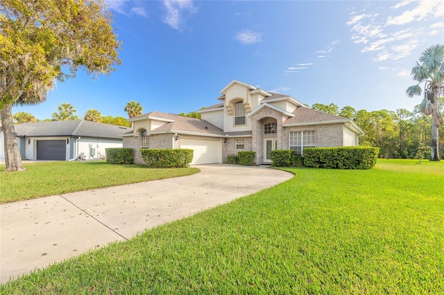 view of front of property with a front yard and a garage