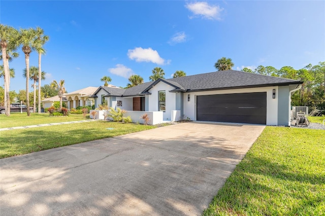 ranch-style home featuring a garage and a front yard