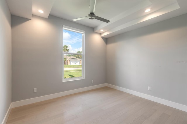 unfurnished room with ceiling fan and light wood-type flooring