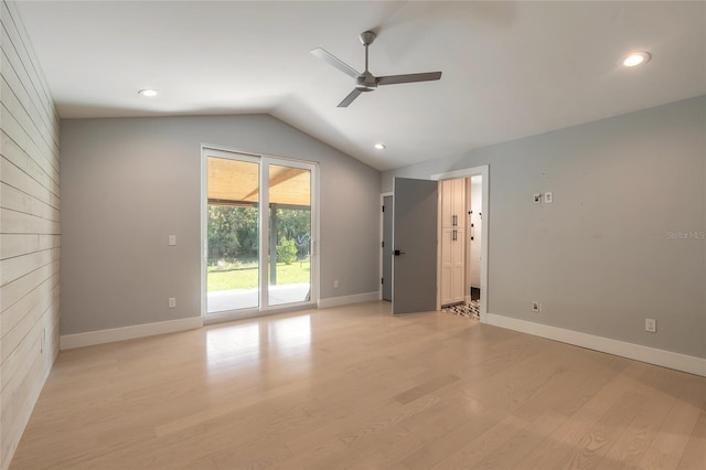 empty room with light hardwood / wood-style flooring, ceiling fan, and lofted ceiling