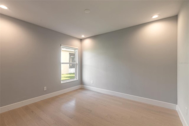 empty room with light hardwood / wood-style floors