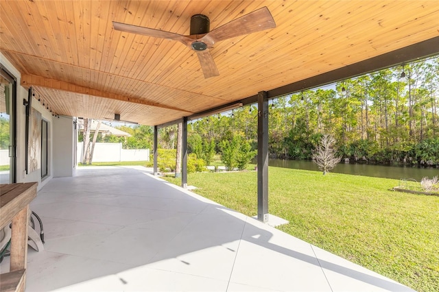 view of patio with a water view