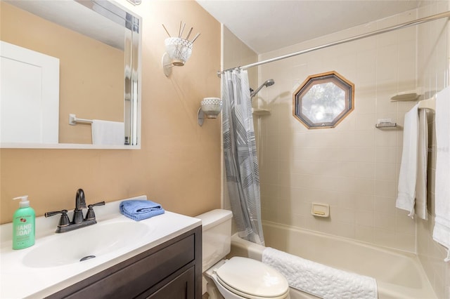 full bathroom featuring vanity, toilet, and shower / tub combo