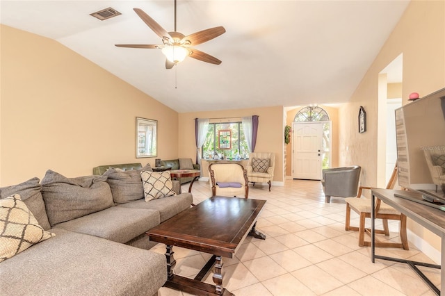 tiled living room featuring ceiling fan and lofted ceiling