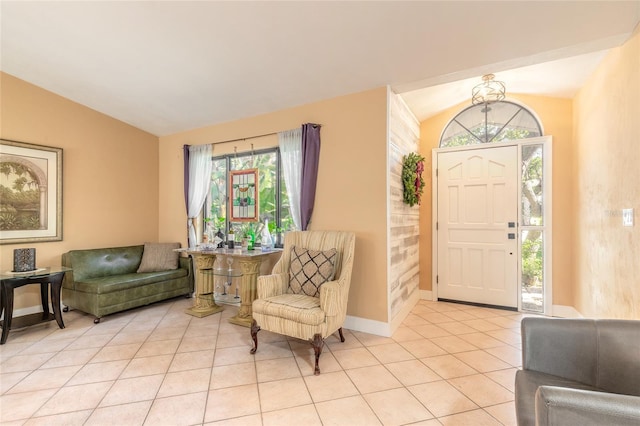 tiled foyer entrance with vaulted ceiling