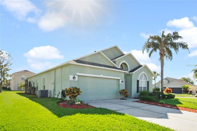 view of front of house featuring central AC, a front lawn, and a garage