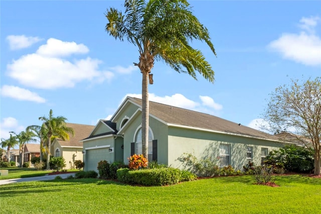 view of home's exterior with a yard and a garage