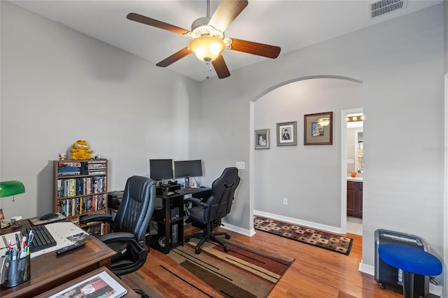 office area with wood-type flooring and ceiling fan