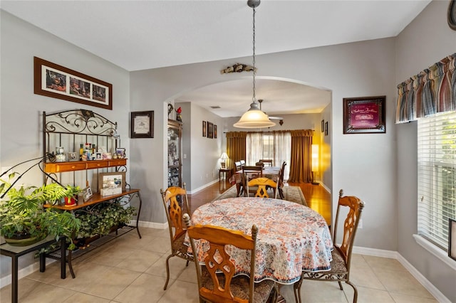 dining area with light tile patterned floors