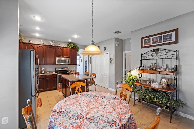 dining area with light tile patterned floors