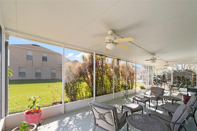 sunroom / solarium with ceiling fan and a healthy amount of sunlight