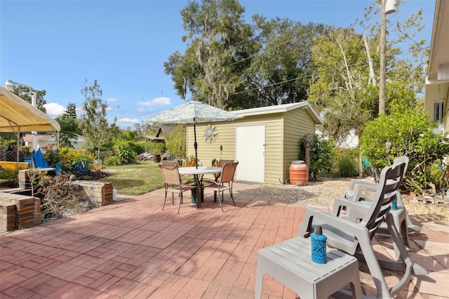 view of patio / terrace featuring a storage unit