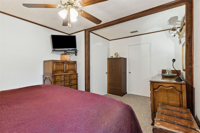 carpeted bedroom featuring ceiling fan and crown molding