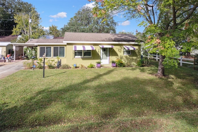 single story home with a carport and a front yard