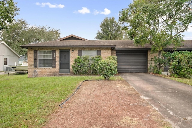 view of front of property featuring a garage and a front lawn