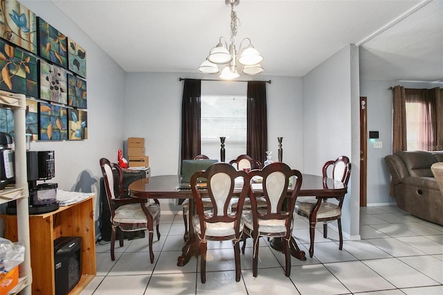 dining room featuring light tile patterned floors and a notable chandelier