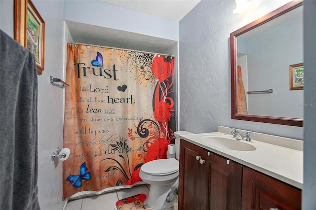 bathroom with tile patterned floors, vanity, a shower with shower curtain, and toilet