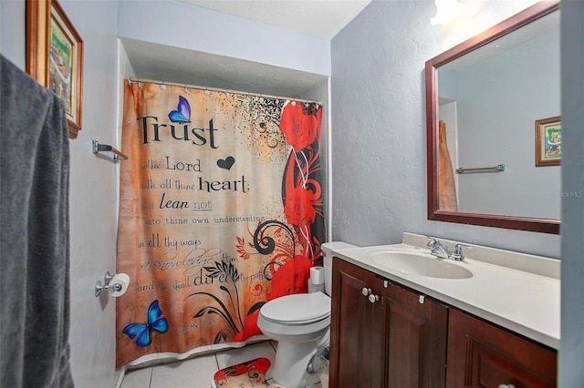 1571 S Boundary St, Deland, FL 32720 - full bath with a textured wall, vanity, toilet, tile patterned flooring, and a shower with shower curtain