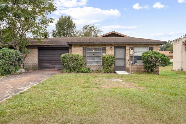 1571 S Boundary St, Deland, FL 32720 - ranch-style home with brick siding, concrete driveway, an attached garage, a front yard, and roof with shingles