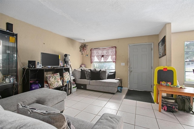 1571 S Boundary St, Deland, FL 32720 - living room with light tile patterned floors and a textured ceiling