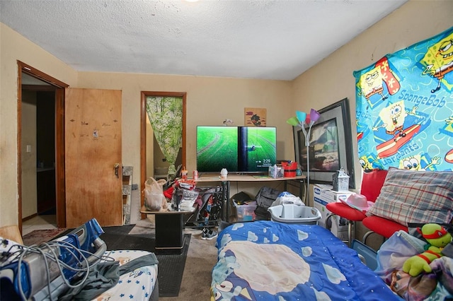 carpeted bedroom featuring a textured ceiling