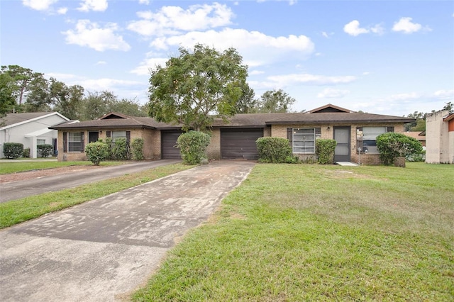 ranch-style home with a garage and a front yard