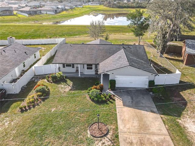 birds eye view of property with a water view