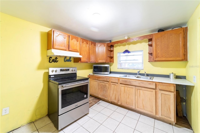 kitchen featuring sink, light tile patterned floors, and appliances with stainless steel finishes