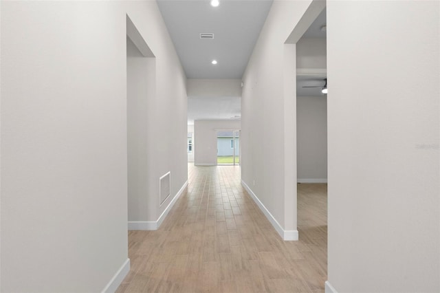 hallway with light wood-type flooring