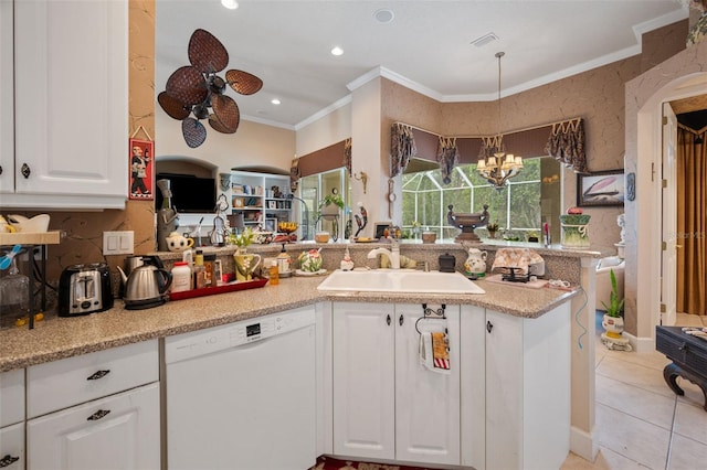 kitchen with dishwasher, crown molding, kitchen peninsula, sink, and white cabinetry