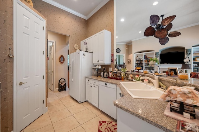 kitchen with ceiling fan, sink, crown molding, white appliances, and white cabinets