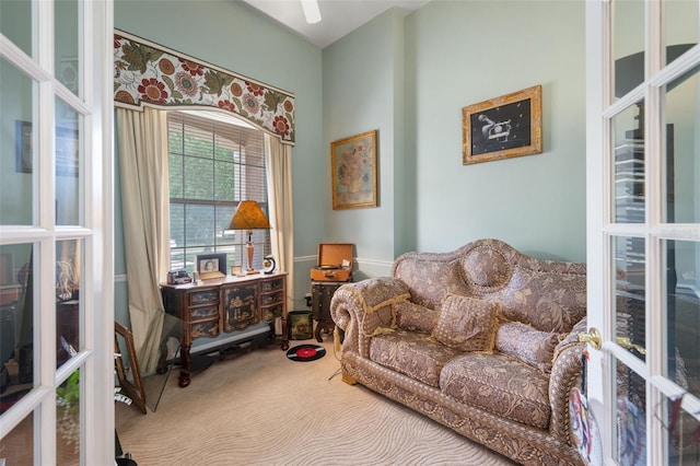 living area with carpet floors and french doors