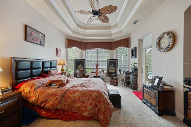 carpeted bedroom with multiple windows, ceiling fan, and crown molding